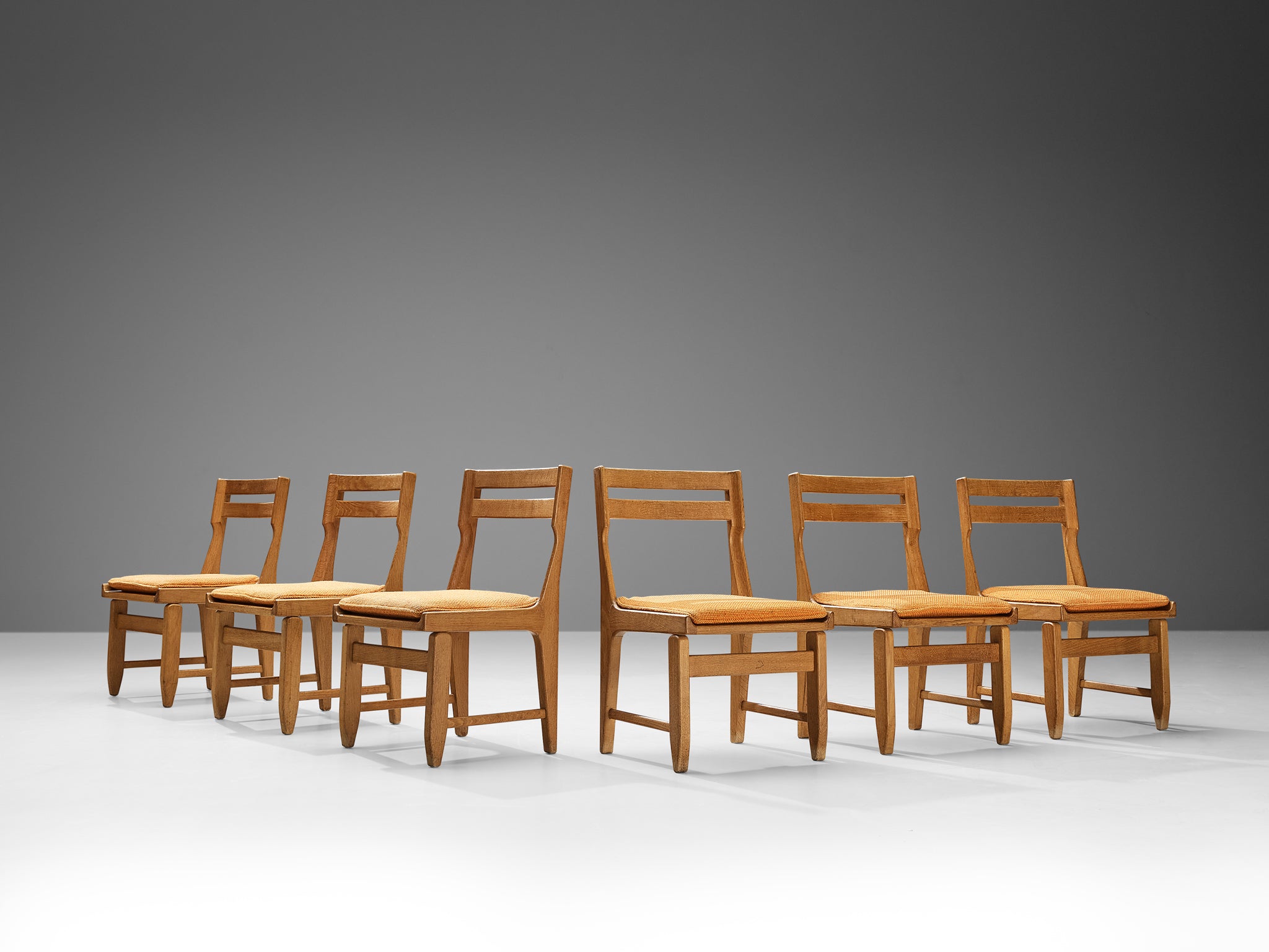 Guillerme & Chambron Set of Six 'Raphaël' Dining Chairs in Oak